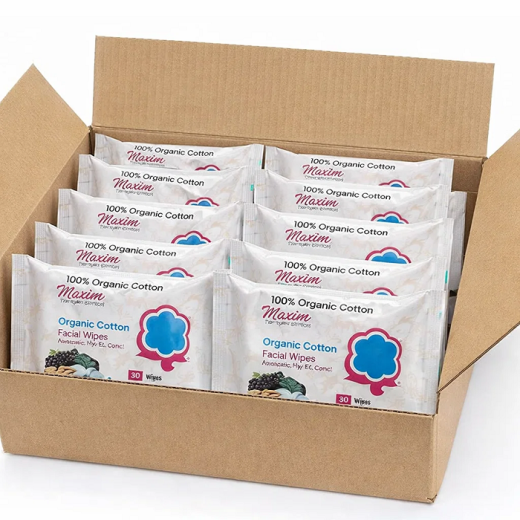 Cardboard display case holding six packs of Maxim Leak Proof Extra Protection Pads (Super), with three black boxes visible in front labeled ‘16 Super’ and ‘New and Improved,’ on a white background.
