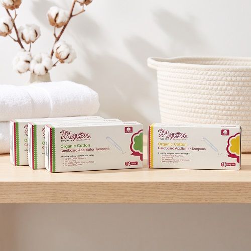 Maxim organic cotton cardboard applicator tampons packaging lineup, showing regular and super absorbency boxes with chlorine-free, non-irritating, fragrance-free cotton tampons.